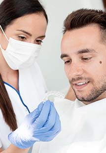 dentist and patient going over oral appliance therapy