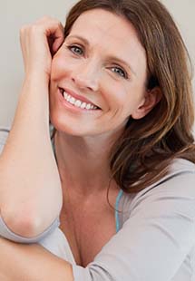 woman smiling after a good night's rest