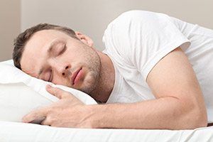 Man sleeping soundly in bed