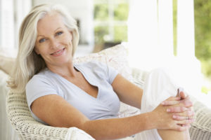 woman sitting outside smiling