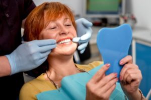 Woman smiling in dentist’s chair.
