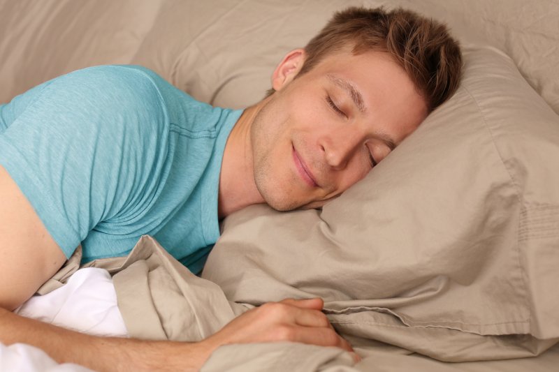 man sleeping peacefully on pillow