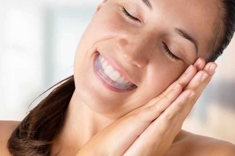 woman sleeping with mouthguard 