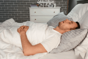 a person struggling to remain asleep 